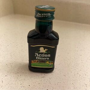 Action Bitters
Source Unknown Green Plastic Bottle